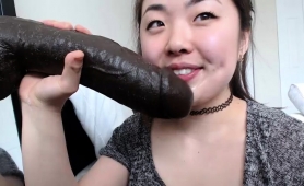 naughty-asian-camgirl-with-nice-tits-sucks-a-huge-black-toy