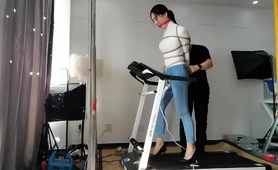 bound-and-gagged-asian-babe-walks-on-treadmill-in-high-heels