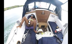 curvy-ebony-babe-pleases-herself-with-a-vibrator-on-a-boat
